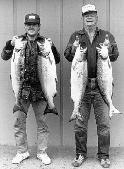 Two men with the fish they caught.